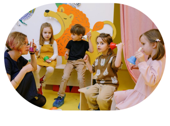 A group of children playing with a teacher

AI-generated content may be incorrect.